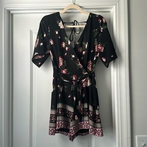 Black romper with floral design